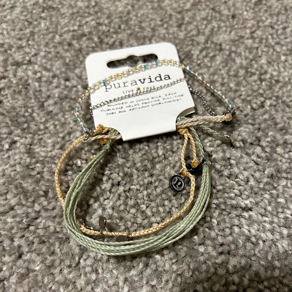 Set of three puravida bracelets.